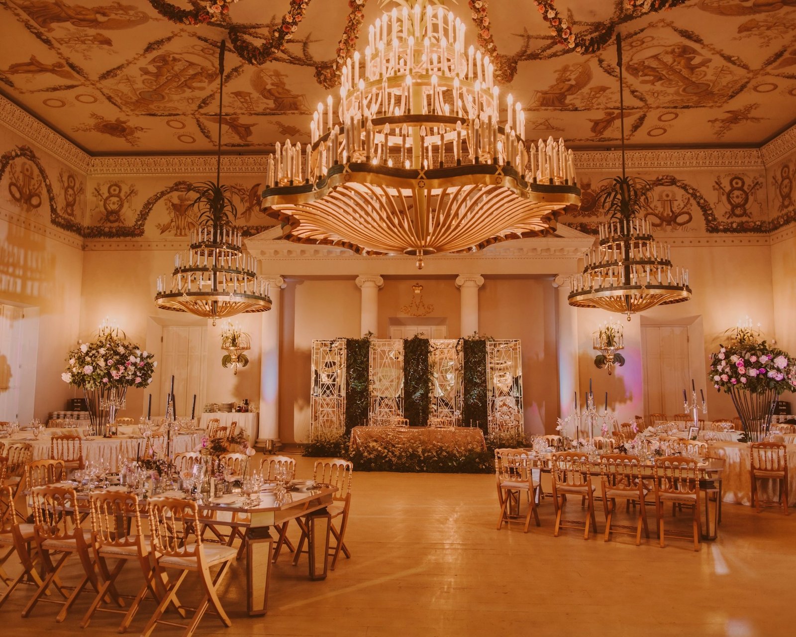 Banquet hall set for a formal reception, with chandeliers