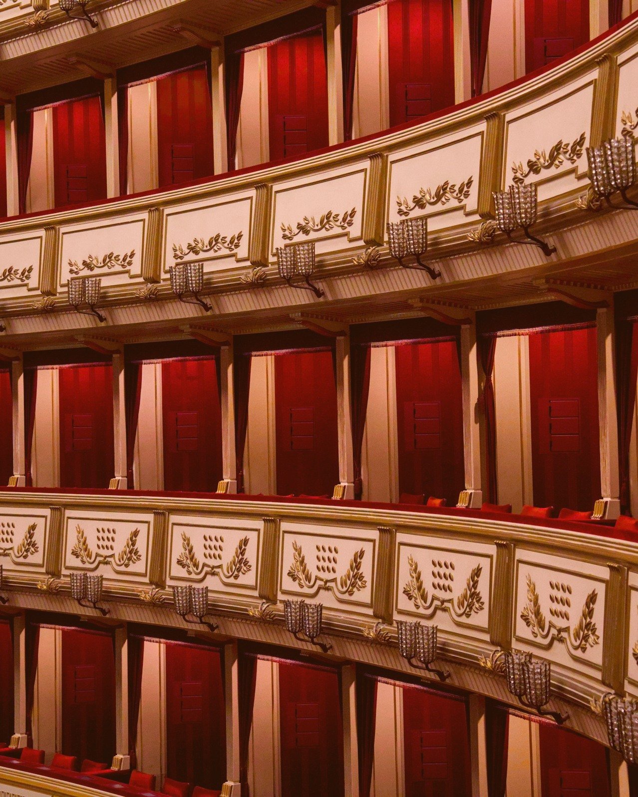 Ornate opera house balconies in red and gold
