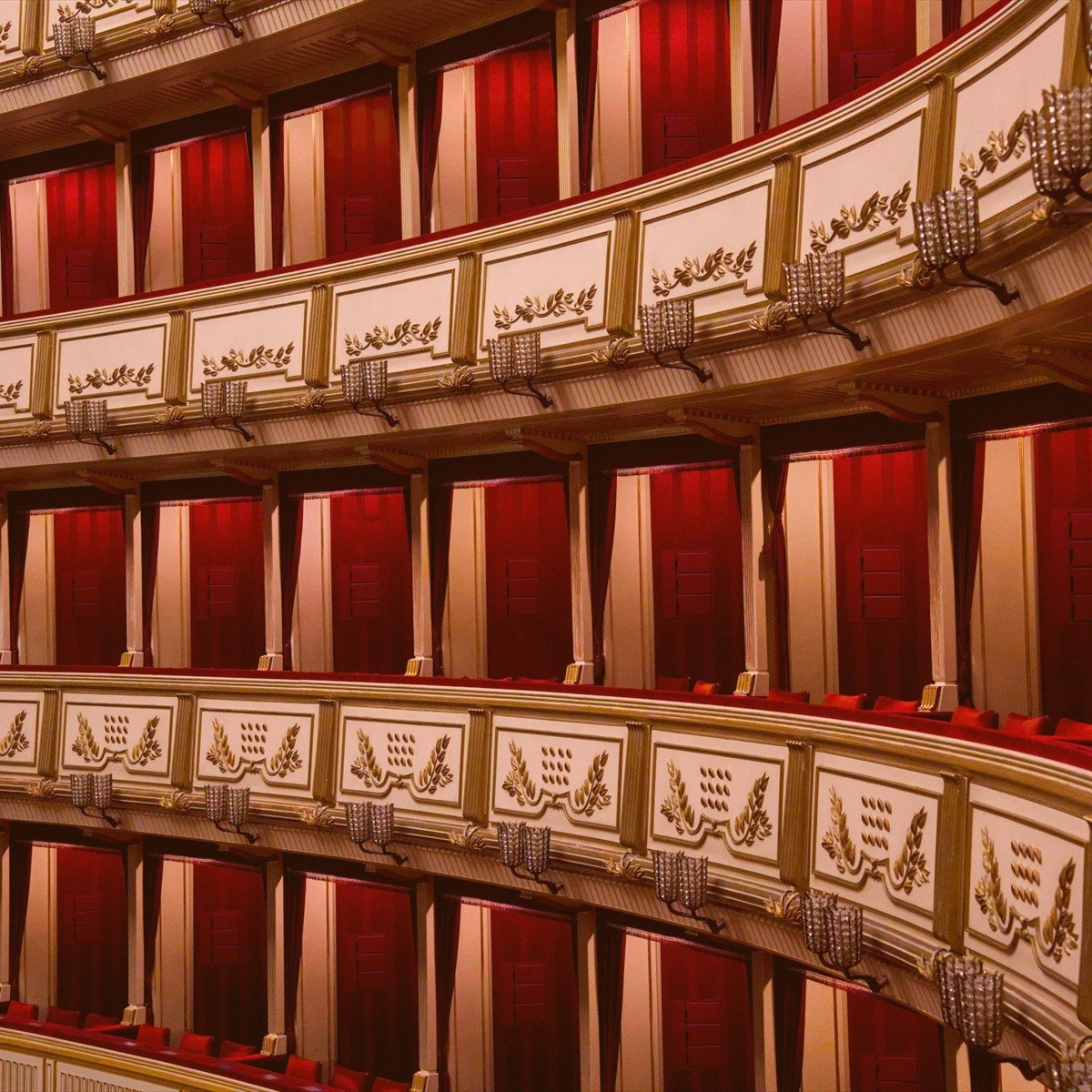 Ornate opera house balconies in red and gold